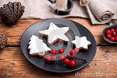 Gingerbread christmas cookies in the black plate. Stock Photo