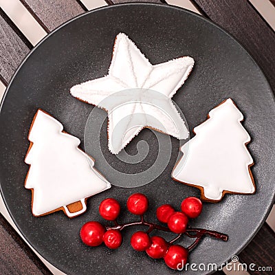 Gingerbread christmas cookies in the black plate. Stock Photo