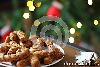 Gingerbread cookies. Plate with tasty homemade Christmas cookies on wooden table. Stock Photo
