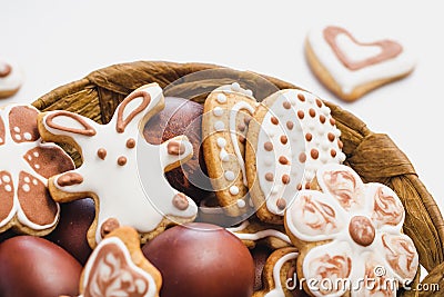 Gingerbread cookies in the shape of an Easter bunny, flowers and hearts, covered with white and chocolate icing-sugar, and easter Stock Photo