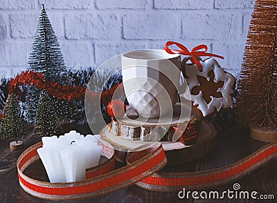 Gingerbread, a cup of coffee and a candle. Festive Christmas and New Year composition with a gift ribbon. Stock Photo