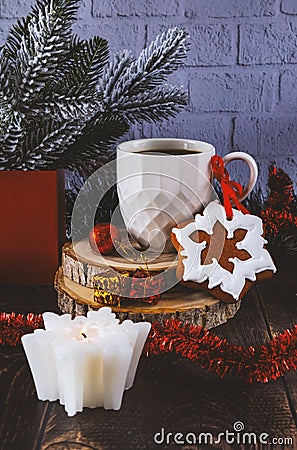 Gingerbread, a cup of coffee and a candle. Festive Christmas and New Year composition with New Year's decor. Stock Photo
