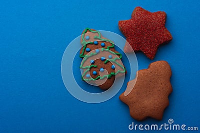 GingerbreadDelicious gingerbread cookies for christmas on blue background Stock Photo