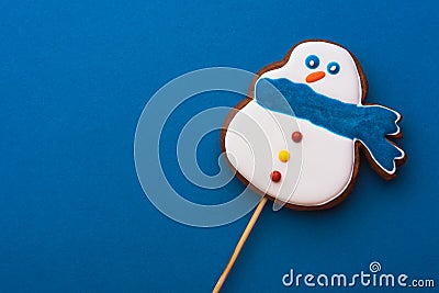 Delicious and delicate snowman on a blue background Stock Photo