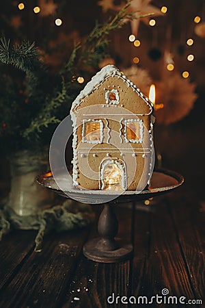 Gingerbread house handmade on dark Christmas background Stock Photo