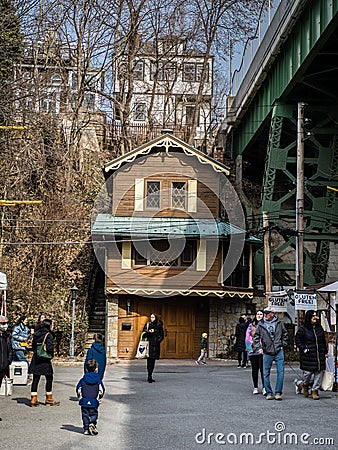 Gingerbread house squeezed under road overpass - 2 Editorial Stock Photo