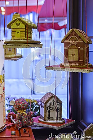 Gingerbread houses hanging in the window Stock Photo