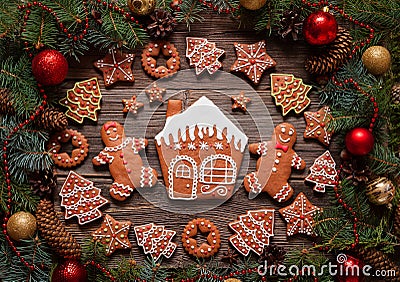 Gingerbread man and woman couple, house, fir trees Stock Photo