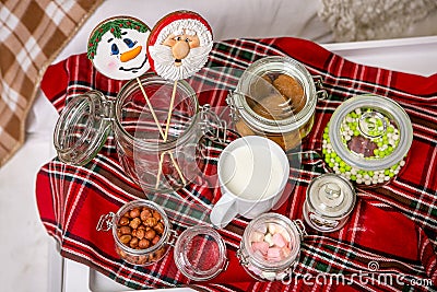 Gingerbread snowman and Santa on a stick on the breakfast table in the bedroom. Holiday sweets. New Year and Christmas theme. Fest Stock Photo