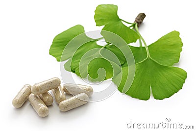 Ginkgo biloba leaves and medicine capsule pills Stock Photo