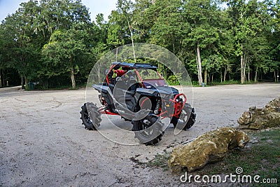 GINNIE SPRINGS, FL. USA - AUGUST 1 2018. Private RZR sport side by side used by the campers to move around the natural park Editorial Stock Photo