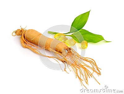 Ginseng root with pills and leawes. Isolated. Stock Photo