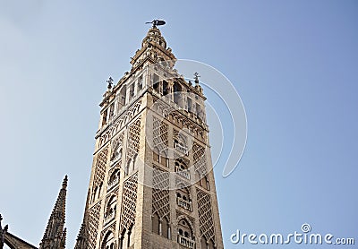 Giralda, famous bell tower of the Seville Cathedral in Spanish city of Sevilla, built as a minaret Stock Photo
