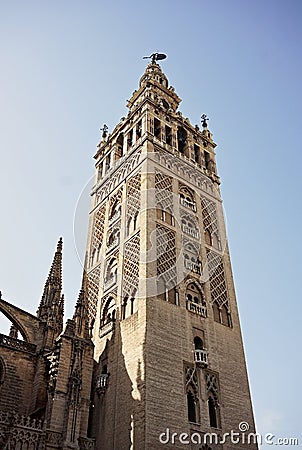 Giralda, famous bell tower of the Seville Cathedral in Spanish city of Sevilla, built as a minaret Stock Photo