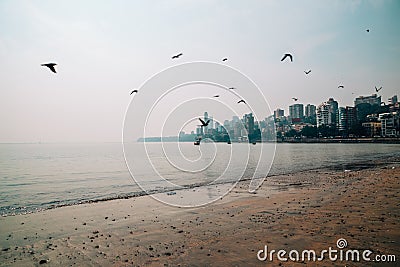 Girgaon Chowpatty beach and modern buildings in Mumbai, India Stock Photo