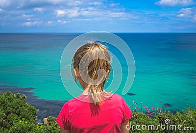 Girl admiring the Cornish coast Stock Photo