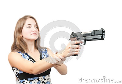 Girl aiming a black gun. Focus on gun only Stock Photo