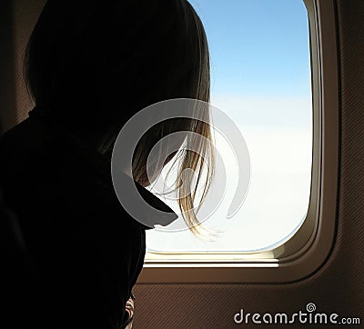 Girl in airplane Stock Photo