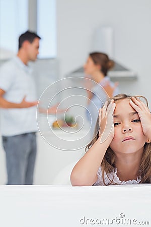 Girl annoyed while listening to parents quarreling Stock Photo