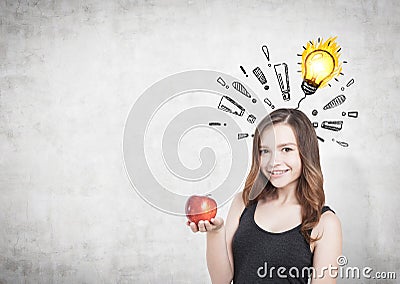 Girl with apple, exclamation marks and bulb Stock Photo