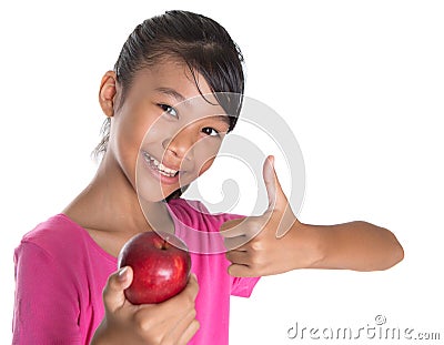 Girl With Apple And Thumbs Up Sign IV Stock Photo