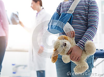 Girl with arm brace in the doctor`s office Stock Photo