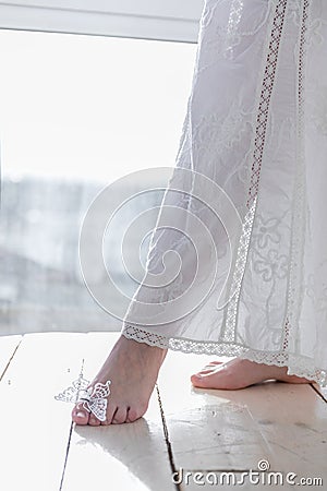 Girl with artificial butterfly on a hand high key Stock Photo