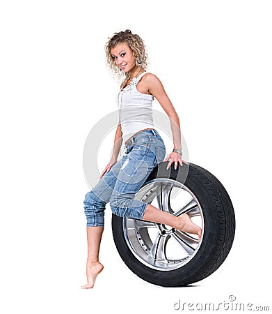 Girl with automobile tyres Stock Photo