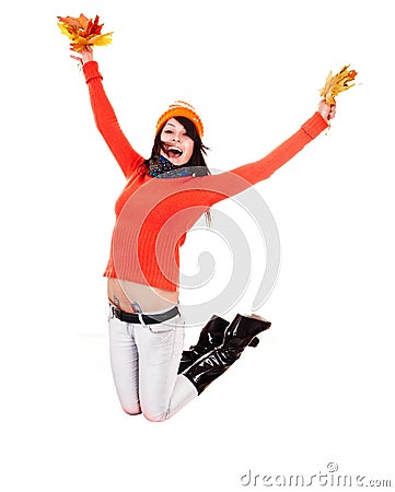 Girl in autumn orange sweater with leaf jump. Stock Photo