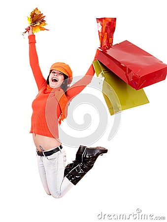 Girl autumn orange sweater, leaf, shop bag jump Stock Photo