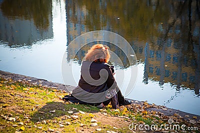 girl in autumn park near the water Editorial Stock Photo