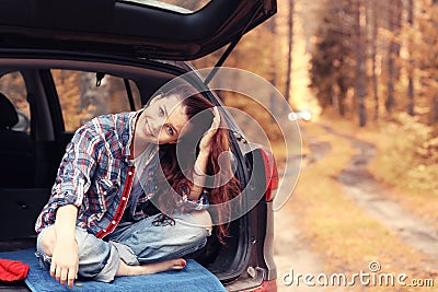Girl at autumn trip by car Stock Photo
