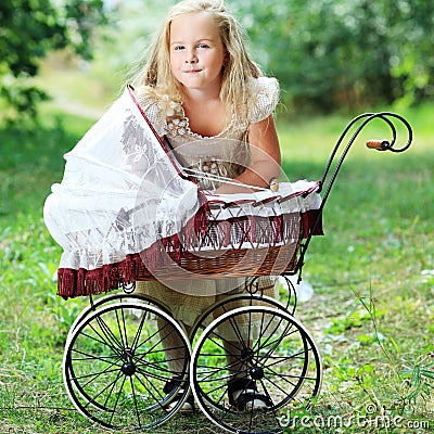 Girl with baby buggy Stock Photo