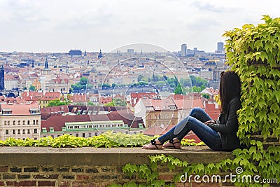 Girl on the background of the panorama of Prague, Czech Republic Editorial Stock Photo