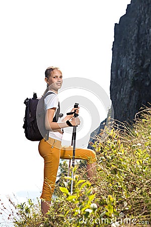 Girl with backpack go up mountain Stock Photo