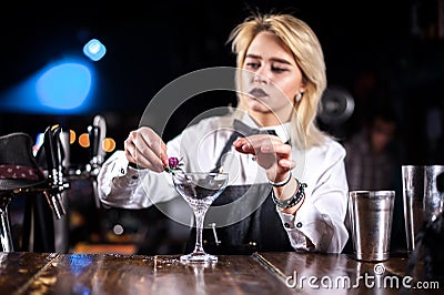 Girl barman creates a cocktail on the taproom Stock Photo