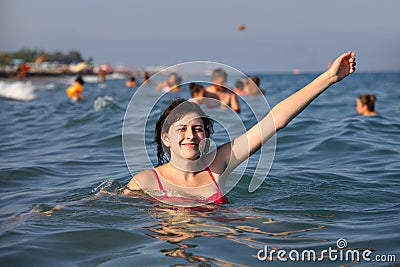 Girl bathes in the sea Stock Photo