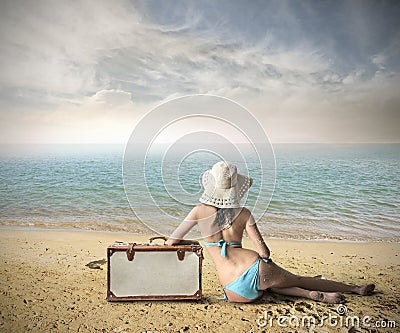 Girl at the beach ready to go away Stock Photo