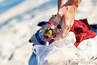 Girl on the beach in Thailand holding a fruit mangosteen Stock Photo