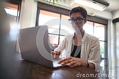 Girl working in a cafe. Freelance concept Stock Photo