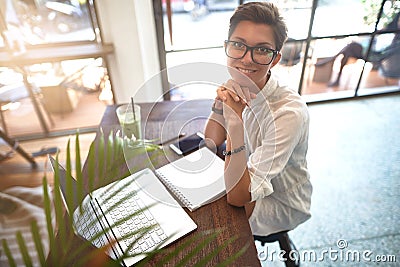 Girl working in a cafe. Freelance concept Stock Photo