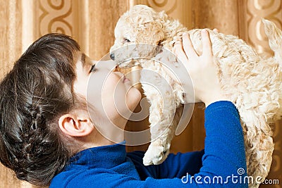 Girl with a beige puppy Stock Photo