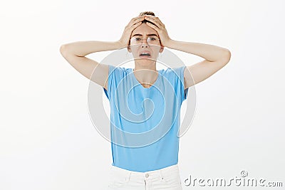 Girl being devestated realising boyfriend cheated on her. Portrait of shocked miserable attractive woman in casual t Stock Photo