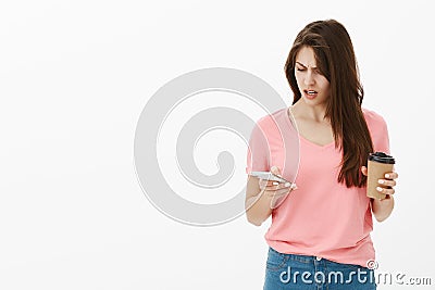 Girl being displeased staring at time, realising friend late for hours. Portrait of frustrated and annoyed good-looking Stock Photo