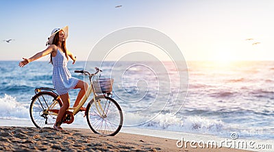 Girl On Bicycle On Beach Stock Photo