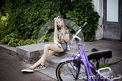 Girl with the bicycle Stock Photo