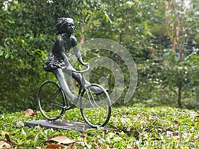 Girl on a Bicycle sculpture. Botanic Gardens, Singapore Editorial Stock Photo