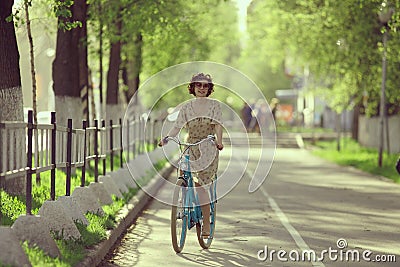 Girl on bicycle at spring morning Stock Photo