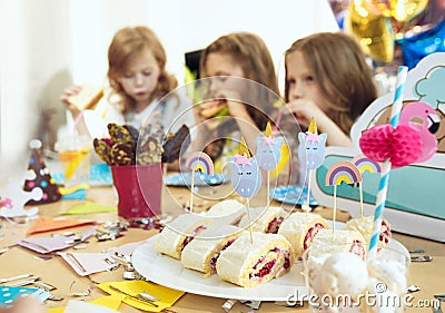 Girl birthday decorations. table setting with cakes, drinks and party gadgets. Stock Photo