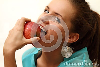 Girl biting red apple Stock Photo